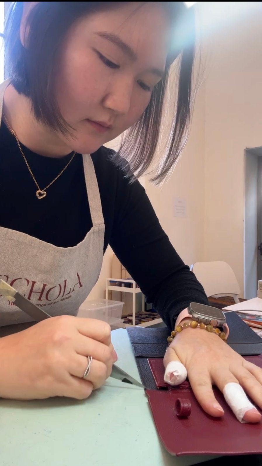 Rosa Kim, Founder and Creative Director of Reverive, working leather in the Florence atelier